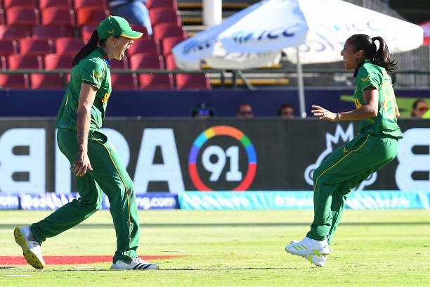South Africa's Shabnim Ismail celebrates with South Africa's Tazmin Brits after the dismissal of England's Alice Capsey during the semi-final T20...