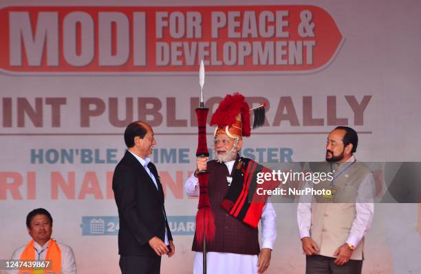 India Prime Minister Narendra Modi is presented with Naga traditional attires by Nagaland State Chief Minister Neiphiu Rio during a public rally...