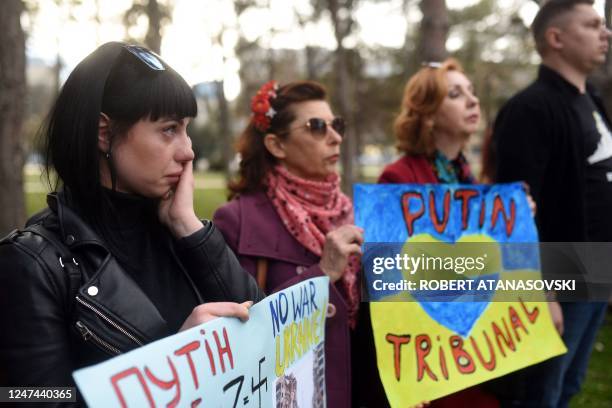 People take part in a rally to mark the first anniversary of the Russian invasion of Ukraine, in Skopje on February 24, 2023.