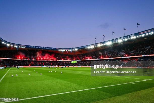 General view as fans lights up some flares during the training session of Paris Saint-Germain at Parc des Princes on February 24, 2023 in Paris,...
