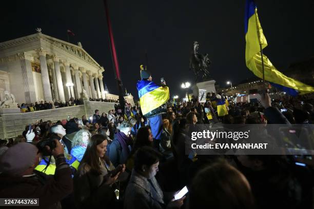 Hundreds of people demonstrate with Ukrainian flags in front of the parliament building in Vienna on February 24 on the first anniversary of the...
