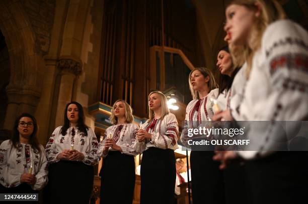 The Fialka Ukrainian choir performs at a 'prayer vigil for peace in Ukraine' at Bradford Cathedral in northern England, on February 24 the first...