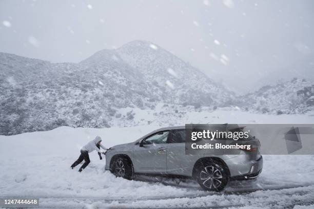 Car stuck in the snow in the San Gabriel Mountains along Angeles Crest Highway during a storm in La Canada, California, US, on Friday, Feb. 24, 2023....
