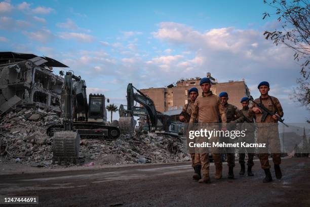 Group of soldiers patrol the streets to ensure the safety of abandoned buildings and the city on February 24, 2023 in Hatay, Turkey. A 7.8-magnitude...