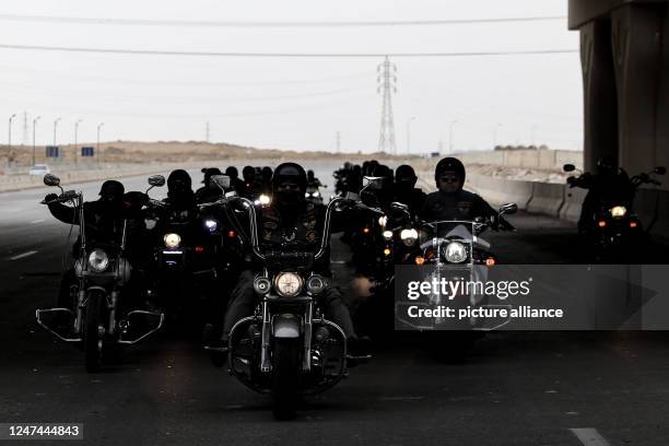 February 2023, Egypt, Cairo: Members of the motorcycle group "Commanders MC" ride their motorbikes during a parade marking the seventh anniversary of...