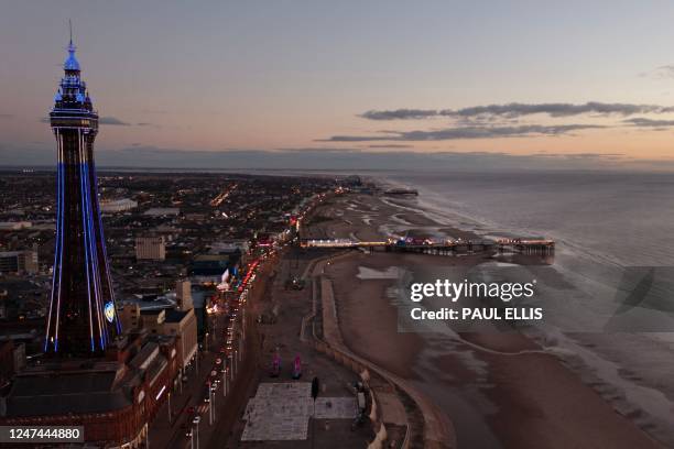 The Blackpool Tower is lit up in the colours of the national flag of Ukraine in Blackpool, north-west England, on February 24 on the first...