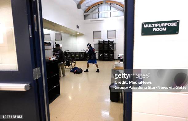 Altadena, CA Boxer Roger Gomez-Peralta of the Villa Parke Boxing of Pasadena warms up in a multipurpose room prior to his bout during the Golden...