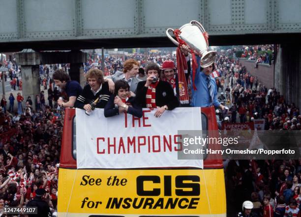 Liverpool fans welcome the team back following their victory over Club Brugge in the European Cup Final in London as they embark on an open-top bus...