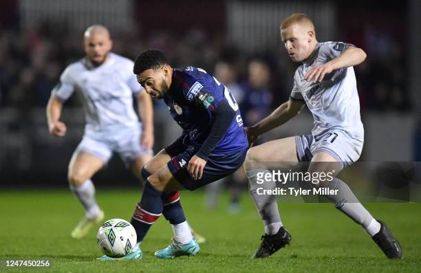 Dublin , Ireland - 24 February 2023; Jake Mulraney of St Patrick's Athletic in action against Gavin Molloy of Shelbourne during the SSE Airtricity...
