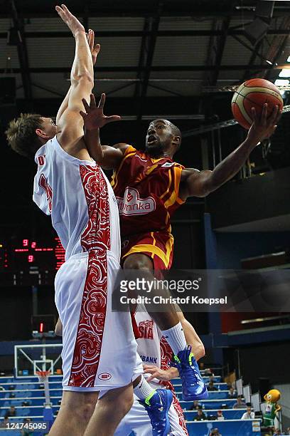 Timofey Mozgov of Russia defends against Bo McCalebb of Macedonia during the EuroBasket 2011 second round group F match between Russia and Macedonia...