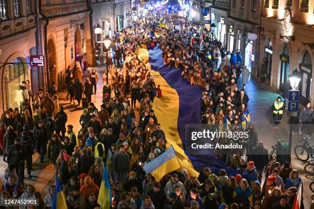 Procession of individuals joined in the symbolic march 'Together to Victory' parading through the streets of Krakow to demonstrate their unwavering...