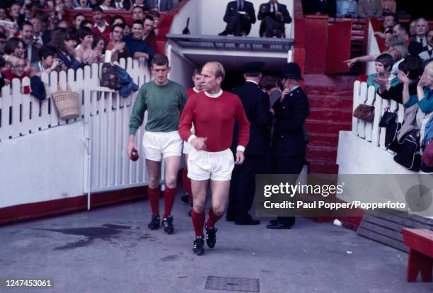 Bobby Charlton of Manchester United walks out of the tunnel followed by goalkeeper Alex Stepney at Old Trafford in Manchester, England, circa 1968.