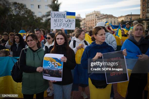 Protesters are seen holding placards during an anti-war protest at Plaza de la Marina square, as Russia's invasion continues in Ukraine. On the first...