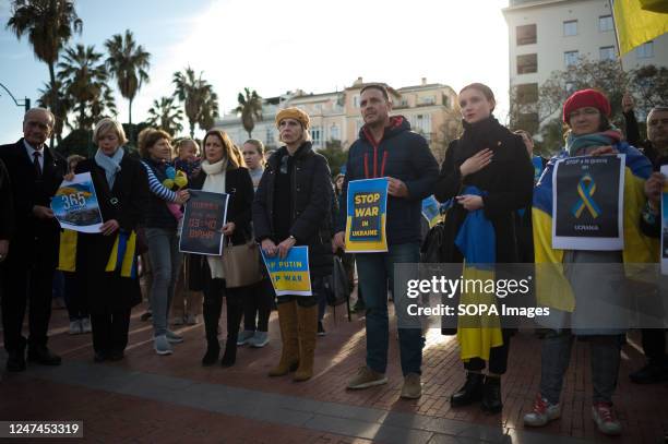 Protesters are seen holding placards during an anti-war protest at Plaza de la Marina square, as Russia's invasion continues in Ukraine. On the first...