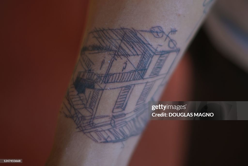 Brazilian musical artist Kdu dos Anjos shows the tattoo of his house...  News Photo - Getty Images