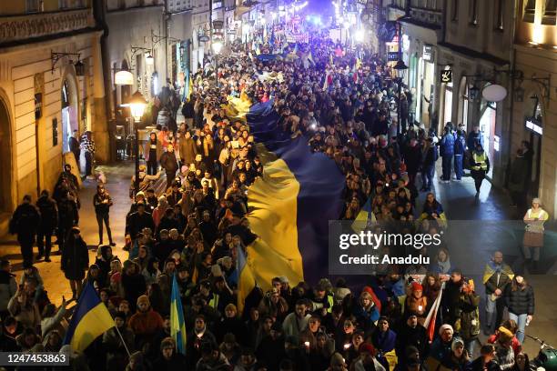 People take part in the march on the 1st anniversary of the war in Ukraine, in Krakow, Poland on February 24, 2023. Two marches were held in the...