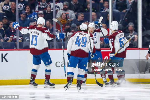 Valeri Nichushkin, Samuel Girard, Nathan MacKinnon and Artturi Lehkonen of the Colorado Avalanche celebrate a first period goal against the Winnipeg...