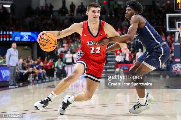 Kyle Rode of the Liberty Flames drives to the basket during a... News ...