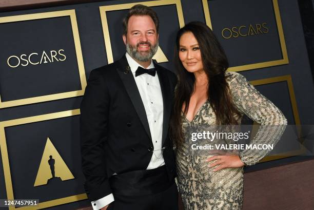 Academy governor Paul Debevec and US actress Tia Carrere attend the Academy of Motion Picture Arts and Sciences' Scientific and Technical awards at...