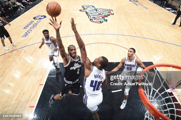 Kawhi Leonard of the LA Clippers drives to the basket during the game against the Sacramento Kings on February 24, 2023 at Crypto.Com Arena in Los...