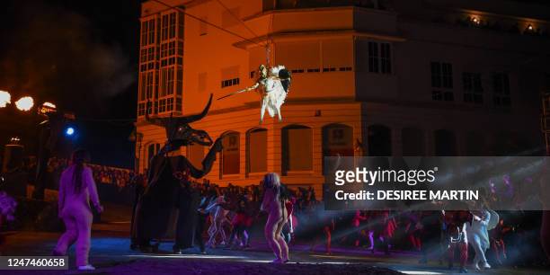 Local non-professional actors, dressed up as evils and witches perform the "Burial of the Sardine" during "Las Burras" festival in Guimar, on the...