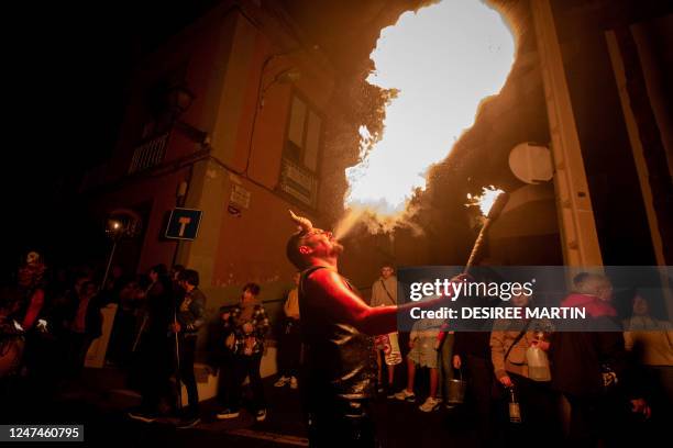 Local non-professional actors, dressed up as evils and witches perform the "Burial of the Sardine" during "Las Burras" festival in Guimar, on the...