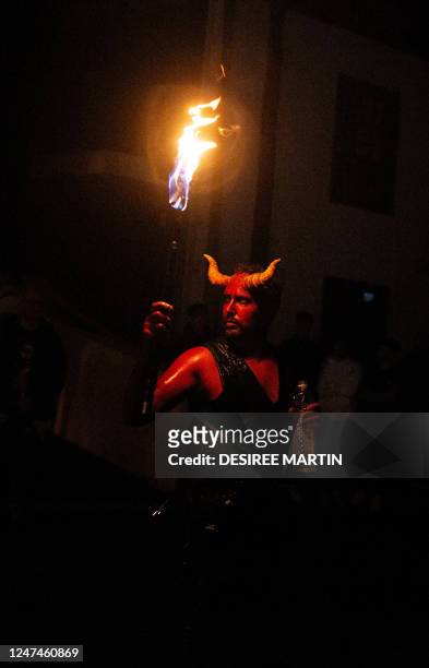 Local non-professional actor, dressed up as evil performs the "Burial of the Sardine" during "Las Burras" festival in Guimar, on the Canary Island of...