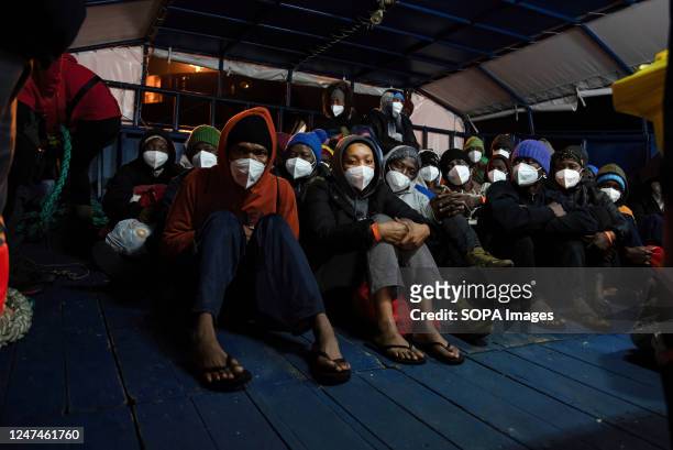 Group of 40 migrants, 20 of whom are minors and 18 of whom are unaccompanied by adults, wait on the stern of the Basque vessel Aita Mari for Italian...