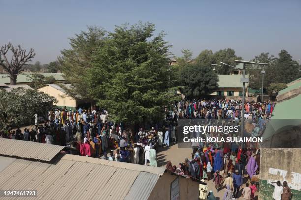 Voters queue to cast their ballots at Kwankwaso ward, Malamai in Kano on February 25 during Nigeria's presidential and general election.