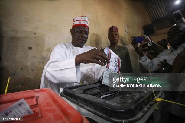 New Nigerian People Party presidential candidate Rabiu Kwankwaso casts a ballot at a polling station in Kano on February 25 during Nigeria's...
