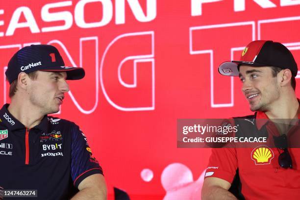 Red Bull's Dutch driver Max Verstappen and Ferrari's Monegasque driver Charles Leclerc attend a press conference during the third day of Formula One...