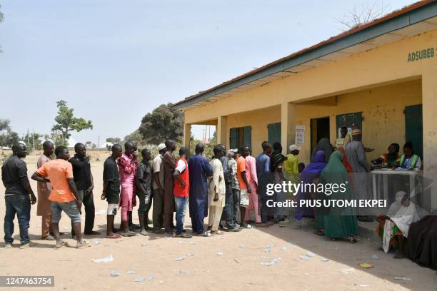 Internally displaced people , who were victims of Boko Haram jihadists, queue to vote at Namtari Ward in Yola on February 25 during Nigeria's...