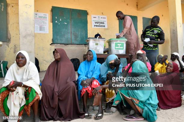 Internally displaced people , who were victims of Boko Haram jihadists, queue to vote at Namtari Ward in Yola on February 25 during Nigeria's...