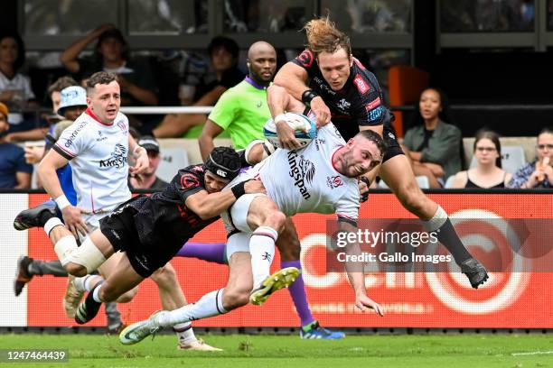 Aaron Sexton of Ulster is tackled by Werner Kok of the Cell C Sharks and Thaakir Abrahams of the Cell C Sharks during the United Rugby Championship...