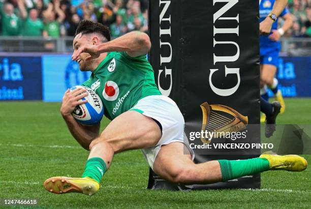 Ireland's full-back Hugo Keenan scores a try during the Six Nations international rugby union match between Italy and Ireland at the Olympic Stadium...