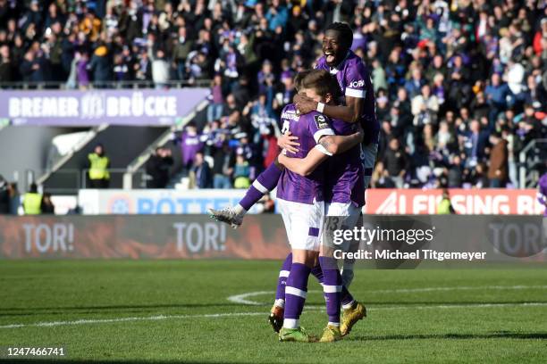 Lukas Kunze of Osnabrueck celebrates with teammates after scoring his team's third goal during the 3. Liga match between VfL Osnabrück and SV Wehen...