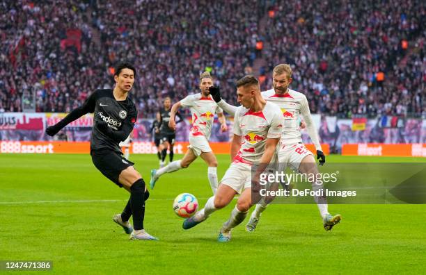 Daichi Kamada of Eintracht Frankfurt shoots on goal during the Bundesliga match between RB Leipzig and Eintracht Frankfurt at Red Bull Arena on...