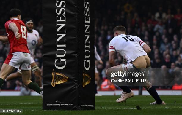 The shorts and underwear of England's full-back Freddie Steward fall down as he runs with the ball during the Six Nations international rugby union...