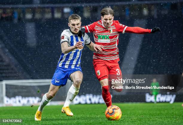 Jonjoe Kenny of Hertha BSC in action with Mads Pedersen of FC Augsburg during the Bundesliga match between Hertha BSC and FC Augsburg at...