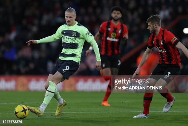 Manchester City's Norwegian striker Erling Haaland vies with Bournemouth's English defender Jack Stephens during the English Premier League football...