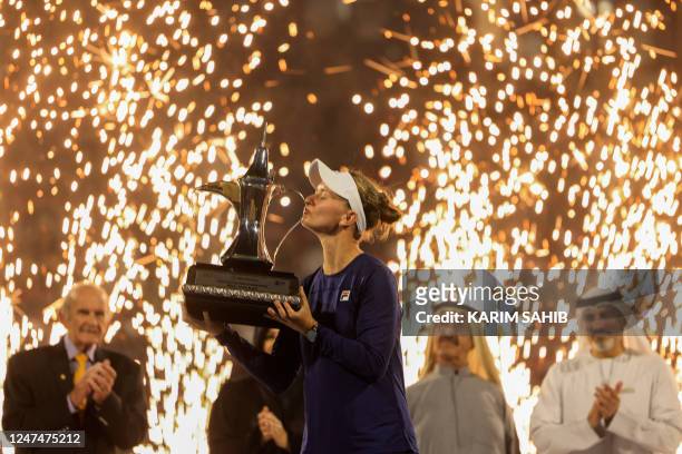 Barbora Krejcikova of the Czech Republic lifts the trophy of the WTA Dubai Duty Free Tennis Championship after defeating Iga Swiatek of Poland in the...