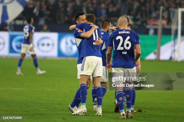 Maya Yoshida of FC Schalke 04 and Marius Buelter of FC Schalke 04 Marius Buelter of FC Schalke 04, scores the team's second goal during the...