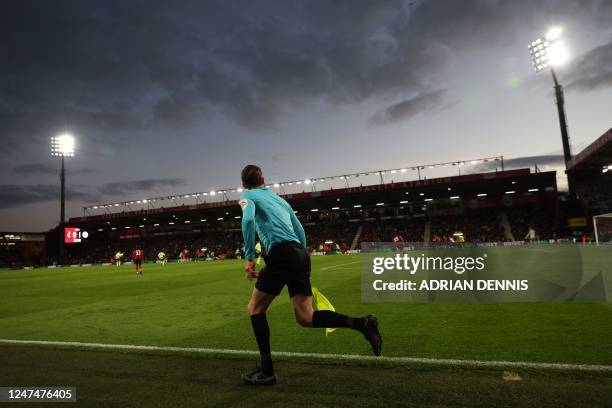 The assistant referee runs along the touch line during the English Premier League football match between Bournemouth and Manchester City at the...