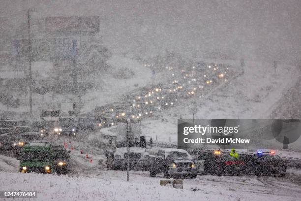 Traffic backs up on the State Route 14 freeway when it is shut down in both directions because of heavy snow on February 25, 2023 near Acton,...