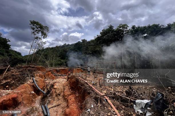 An officer of the Brazilian Institute of Environment and Renewable Natural Resources takes part in an operation against Amazon deforestation at an...