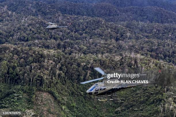 Aerial picture showing officers of the Brazilian Institute of Environment and Renewable Natural Resources on helicopters taking part in an operation...