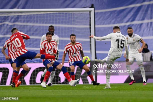 Real Madrid's Uruguayan midfielder Federico Valverde attempts to score during the Spanish League football match between Real Madrid CF and Club...