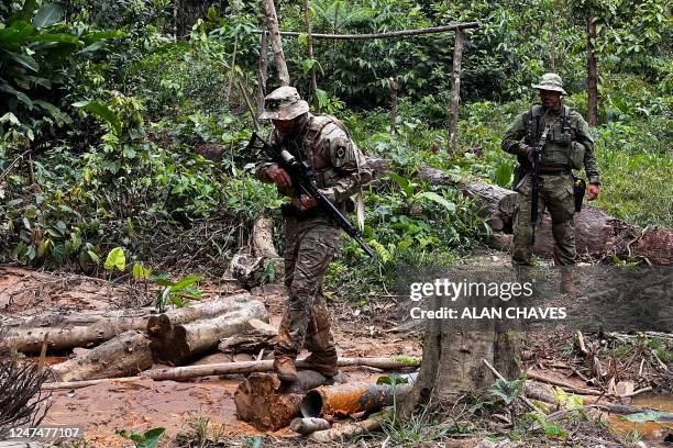 Officers of the Brazilian Institute of Environment and Renewable Natural Resources take part in an operation against Amazon deforestation at an...