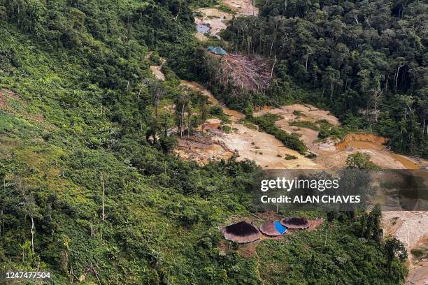 Aerial view of an illegal mining camp surrounding huts of an indigenous tribe, taken during an operation by the Brazilian Institute of Environment...