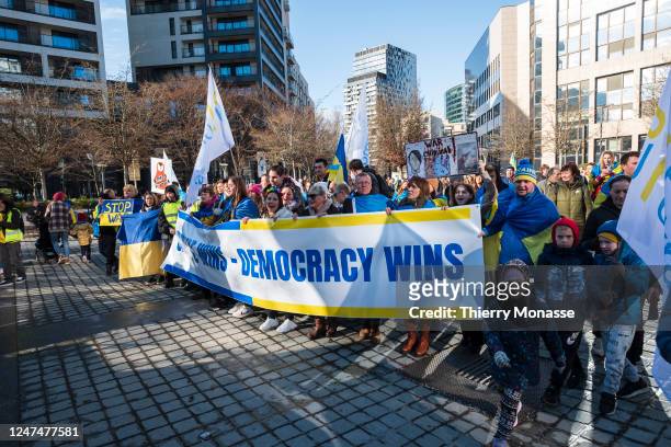Ukrainians demonstrate in the street of Brussels under the slogan: 'If Ukraine wins - Democracy wins' for the first anniversary of the invasion of...